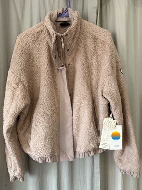 Vuori Cozy Sherpa Jacket, color: Umber (Dusty Pink), Size Medium.